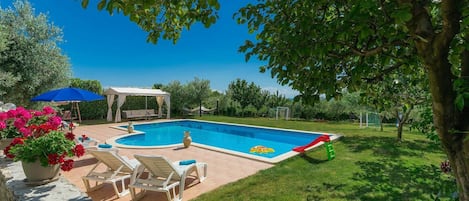 Water, Plant, Swimming Pool, Sky, Tree, Outdoor Furniture, Shade, Building, Chair, Leisure