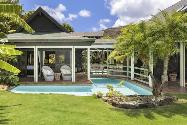 Primary Suite is a Stand Alone Suite connected to the main house via the covered Lanai.