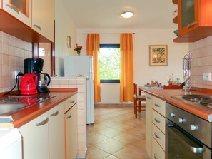Cabinetry, Countertop, Property, Furniture, Drawer, Wood, Kitchen, Building, Lighting, Interior Design