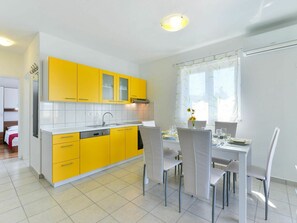 Furniture, Cabinetry, Window, Building, Countertop, Chair, Kitchen, House, Yellow