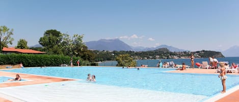 Sky, Water, Swimming Pool, Azure, Mountain, Tree, Leisure, Resort Town, Shade, Recreation