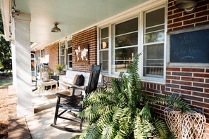 2 rocking chairs and church pew on the porch!