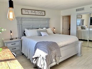 Gorgeous master bedroom with an amazing view of beach! Relax and enjoy! 