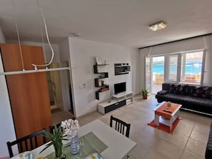 dining room , living room and view on the sea
