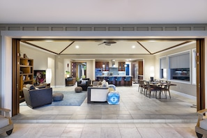 The Great Room of this Holua Kai Kona condo rental as seen from the back lanai.