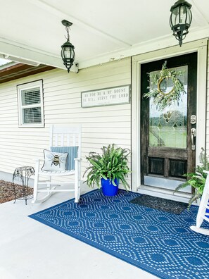 Eric put new wooden steps, railing and columns with a weathered look. 