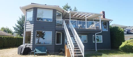 Back of our home, looks on to the ocean/beach.  Covered deck on the second floor