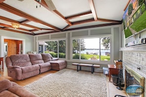 Living room with smart T.V. and lake views