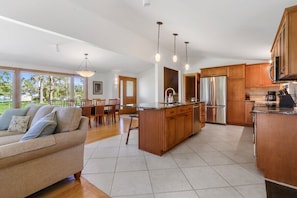 Large fully equipped kitchen with open concept to dining area. Convenient breakfast bar seating   that seats 4.