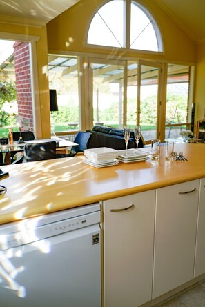 Full kitchen with dishwasher for your convenience. Watch the kids play outside.