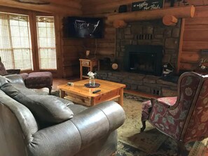 Living Room showing 50" Smart TV and gas fireplace