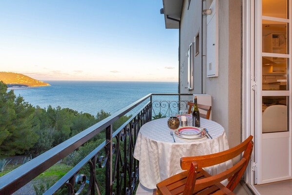 Outside balcony with sea view and table