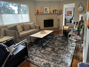 Living Room with wood-burning fireplace.