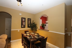 Dining area with table, 4 chairs and bench seat. Will sit up to 7 persons.