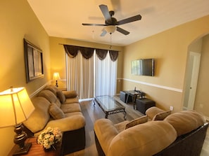 Lounge/dining area with large screen smart TV.  Relax in comfort