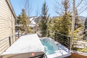 Private hot tub with incredible slope views located on balcony.