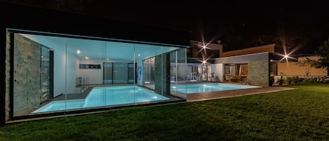 Indoor & outdoor pools (night)