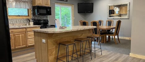 Dining area with TV that includes Netflix and Amazon subscriptions