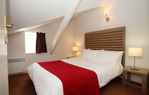 Drift off to sleep in the plush beds. Bedding configurations may vary.