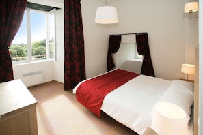 Get a peaceful night sleep in our cozy bedroom.