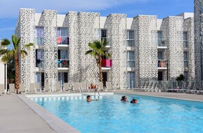 Get some sun in the seasonal outdoor pool.