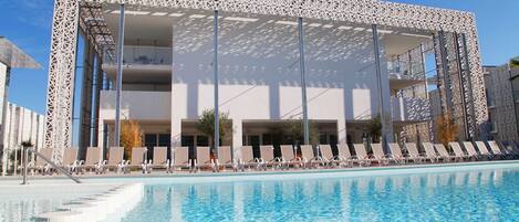 Lounge around the on-site outdoor pool.