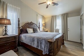 The master bedroom is tastefully decorated with gorgeous bed and substantial nightstands to place phone/ keys/ books/ laptops or whatever you need close by.  Ceiling fan is nice for added comfort.