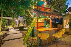 Step right up to the treehouse tiki bar