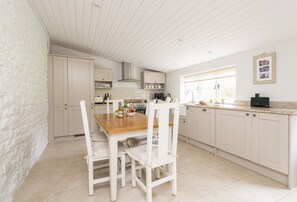 Vicarage Cottage, near Bridport: Dining kitchen with views of the garden