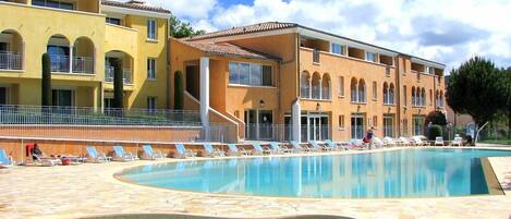 Dive into the outdoor pool on a hot summer day.