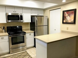 New kitchen with new appliances including dishwasher 