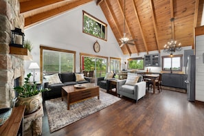 Main Level open floorplan living, dining, and kitchen space.