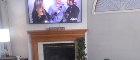 Smart TV with  fireplace in living room