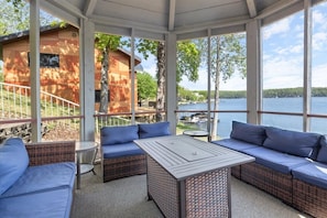 Screened gazebo with seating for 8.