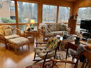 Sunroom- Lounging areas with large floor to ceiling  windows.