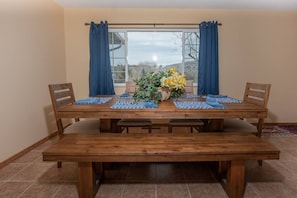 Dining area adjacent to kitchen to enjoy your meals together with plenty of seating for all.