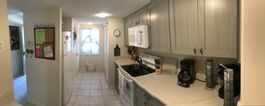 Kitchen and adjoining laundry room