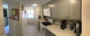 Kitchen and adjoining laundry room