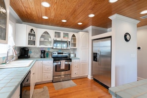 Spacious kitchen complete with stainless steel appliances