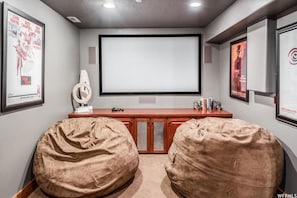 Movie room with 5 theatre reclining seats and beanbags 