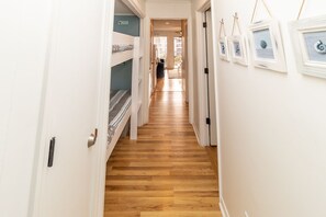 1 Queen Bedroom, hallway bunks and living room/kitchen combo condo