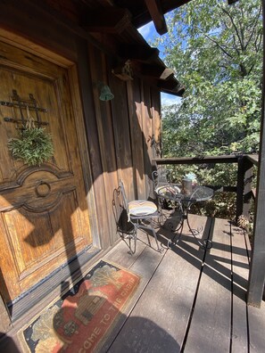 Front door with small patio area 