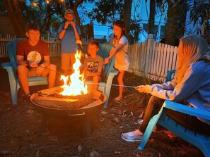 Roasting marshmallows at the end of a long day at the beach is so fun 