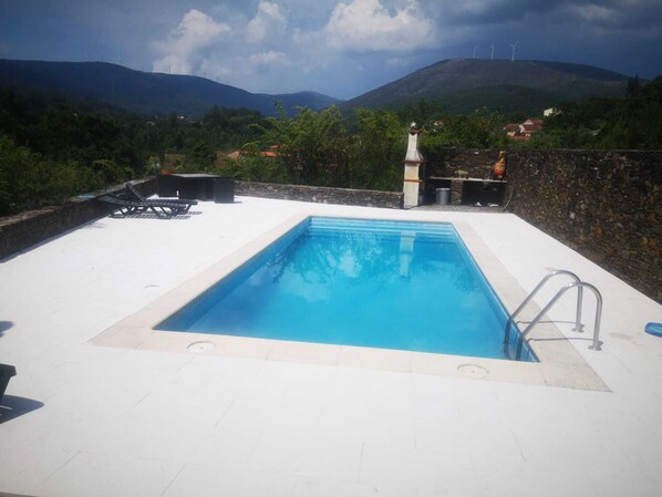 Private pool with a view of the surrounding mountains,  for guests to enjoy.