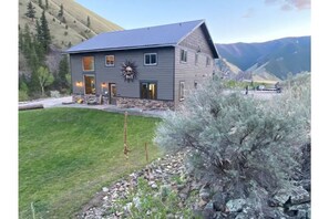 view of the cabin from the outside and lawn.