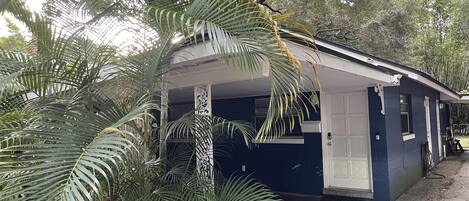 Covered private entrance with carport right outside of front door.