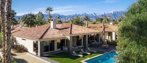 Rear view with Bocce Ball court on left and lap pool and spa facing out to golf 