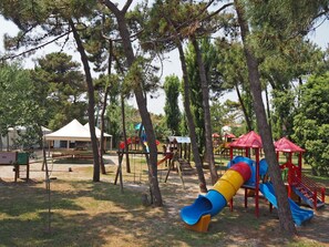 Playground, Public Space, Outdoor Play Equipment, Human Settlement, Recreation, Tree, City, Leisure, Play, Park