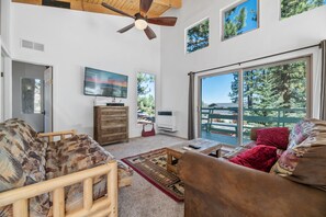 VIERWS from above. Cute upstairs living room. - VIEWS from above. This living room has a futon couch and a big flat screen TV!