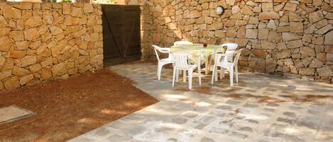Floor, Property, Flooring, Wall, Table, Brick, Outdoor Table, Chair, Stone Wall, Flagstone